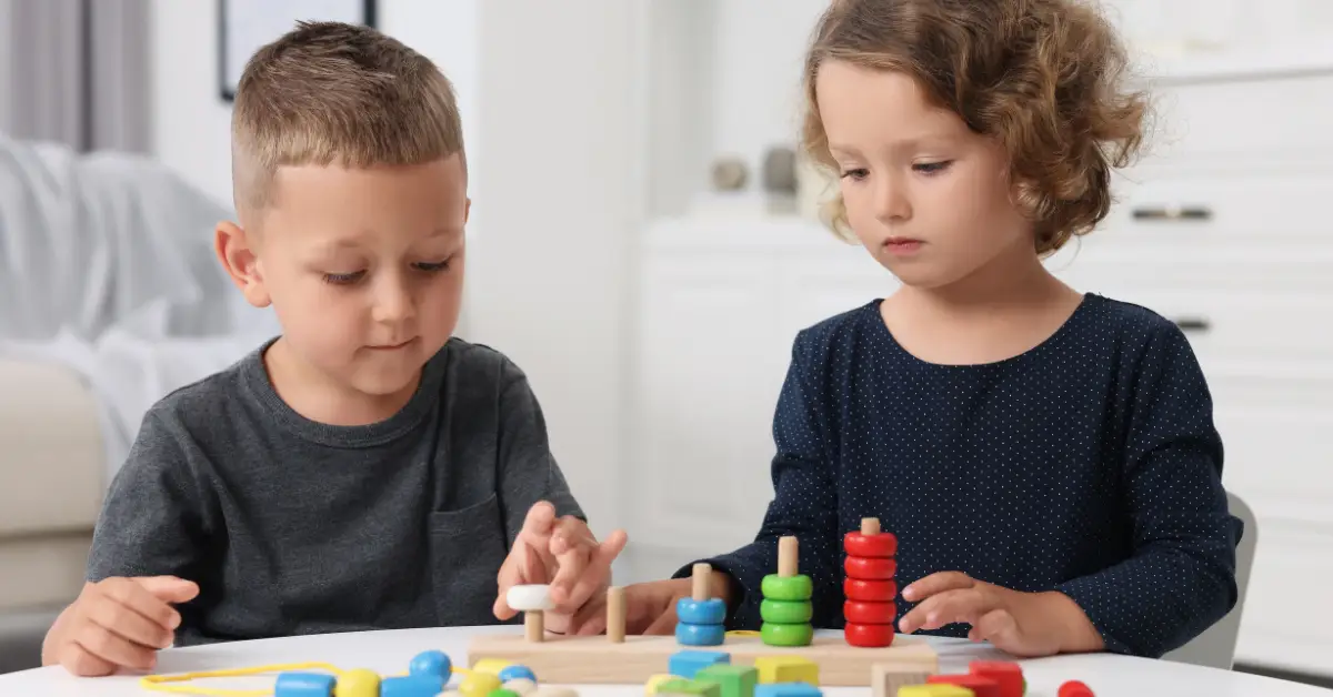 Two children engaging in interactive play (decorative for How to Boost Cognitive Skills in Neurodivergent Children blog)