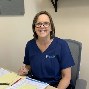 Coach Jackie at her desk